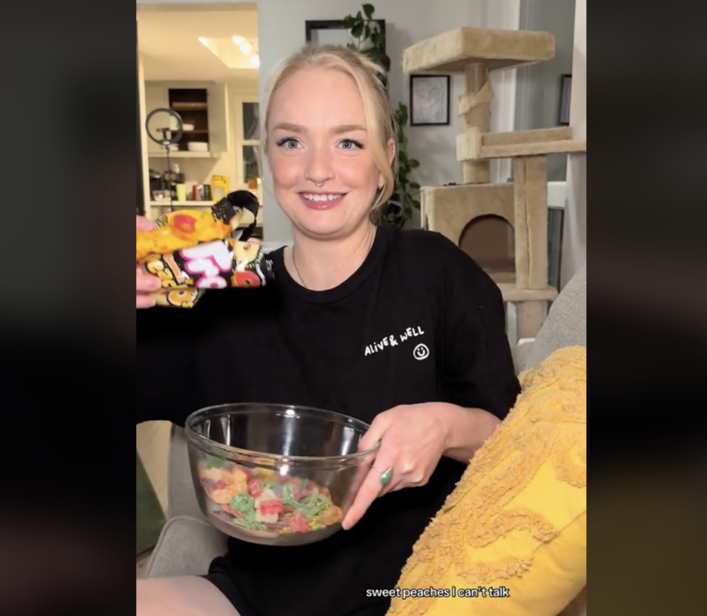 Woman in a TikTok video dumping candy into a bowl